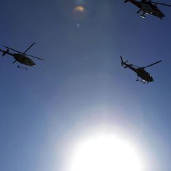 Helicopters fly in formation during the funeral for Ogden police officer Jared Francom in Ogden  Wednesday, Jan. 11, 2012. Francom, a seven-year veteran of the force, was killed in the line of duty on Jan. 4, while serving a warrant. Five other law enforcement agents were wounded on the scene.