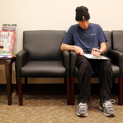 Derick Balser fills out some paperwork at South Temple Dental in Salt Lake City on Monday, March 21, 2016, prior to Dr. Spencer Updike conducting a free dental screening to help Balser with his dental health.