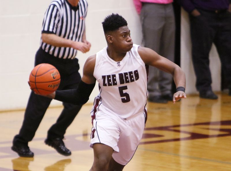 Zion-Benton senior Admiral Schofield launches a pass down court for a fast play against Lake Zurich. 
