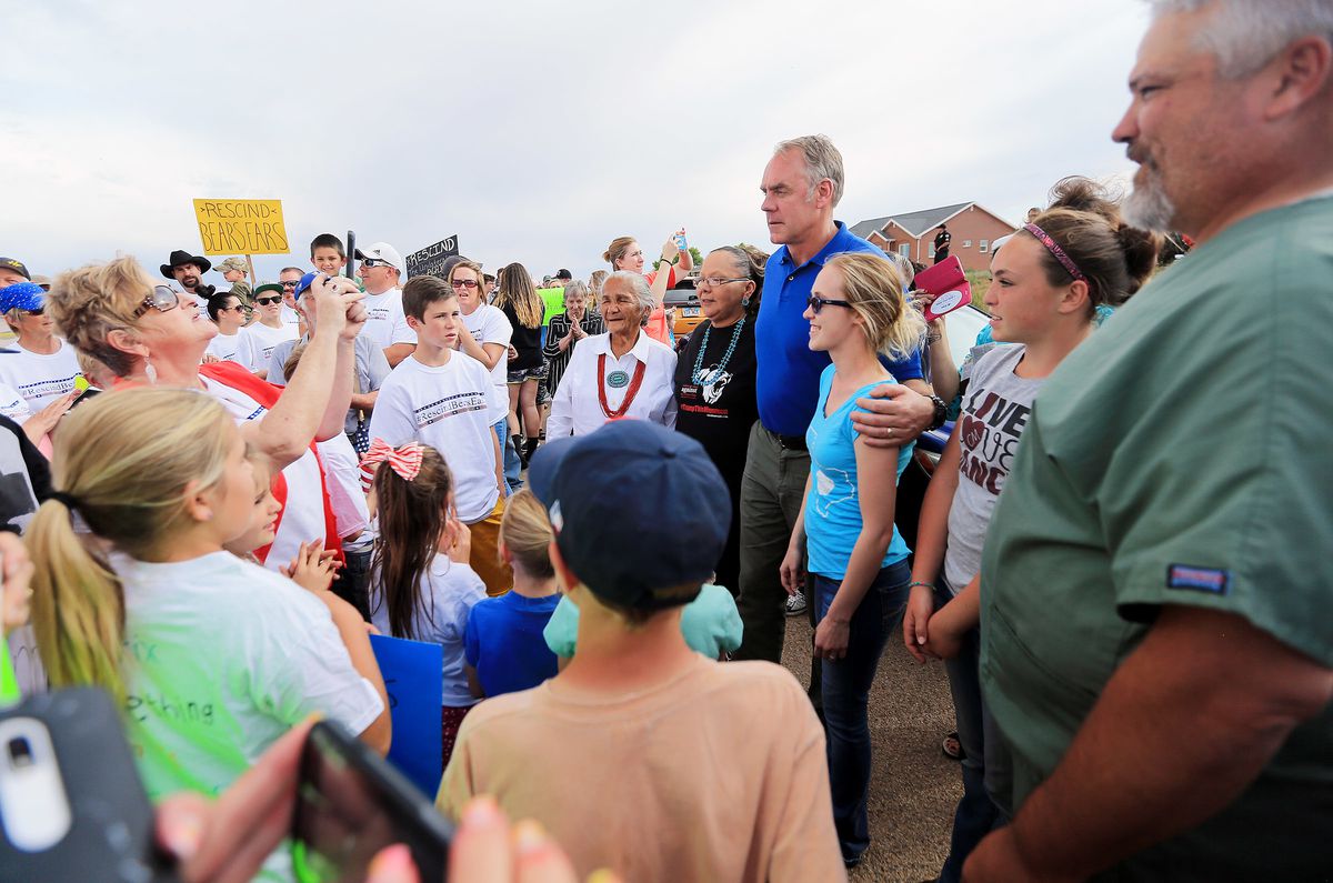Interior Secretary Ryan Zinke poses for photos with people who want the Bears Ears National Monument rescinded during a rally in Blanding on Monday, May 8, 2017.