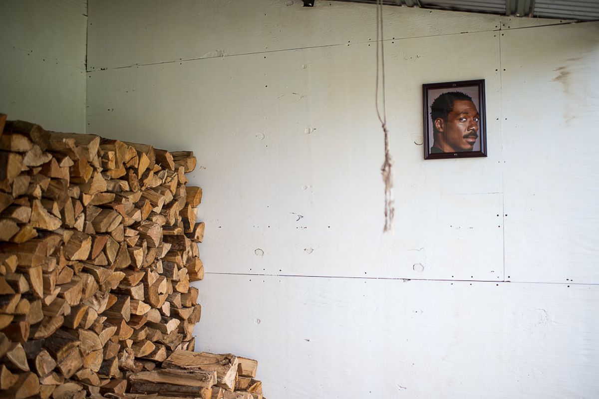 A photo of Eddie Murphy hangs near a pile of wood at Roberta’s, sister spot to Blanca