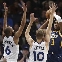 Utah Jazz guard Trent Forrest (3) tries to pass the ball against Minnesota Timberwolves guard Jordan McLaughlin (6) and forward Jake Layman (10) during the second half of an NBA basketball game Wednesday Dec. 8, 2021, in Minneapolis. Utah won 136-104. 