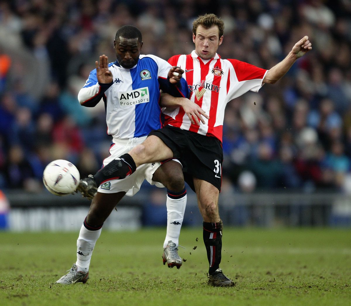 Marcus Stewart of Sunderland tackles Andrew Cole of Blackburn Rovers