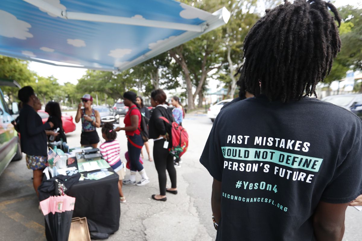 Local activists share information about the Amendment 4 ballot initiative on Oct. 22, 2018. A trio of new lawsuits argue that a new Florida law unconstitutionally  limits how many people can immediately get their voting rights restored.