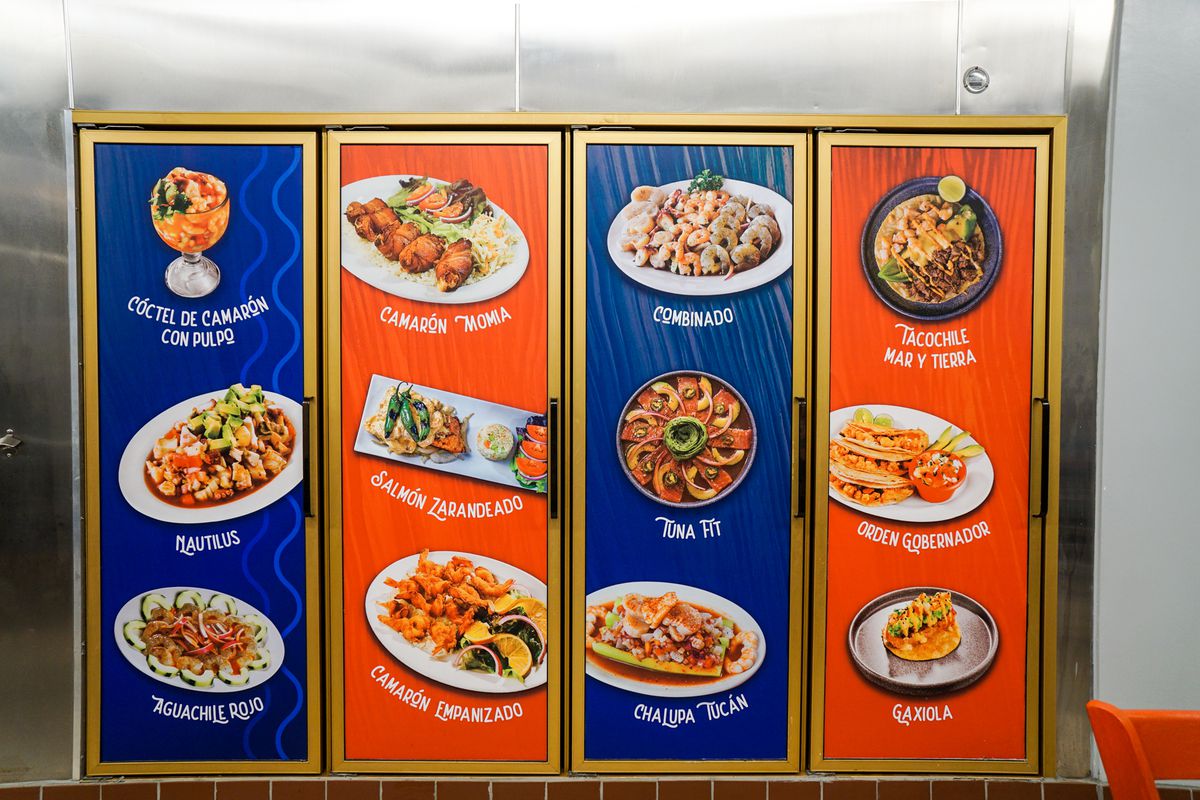 Murals on fridge doors at a Sinaloan seafood restaurant.