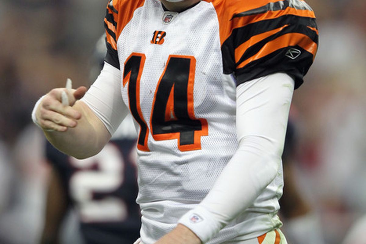 HOUSTON, TX - JANUARY 07:  Andy Dalton #14 of the Cincinnati Bengals reacts against the Houston Texans during their 2012 AFC Wild Card Playoff game at Reliant Stadium on January 7, 2012 in Houston, Texas.  (Photo by Jamie Squire/Getty Images)