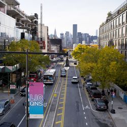 In this Wednesday, Nov. 7, 2018, photo, traffic moves along 44th Drive in Long Island City, Wednesday, Nov. 7, 2018, in the Queens borough of New York. Long Island City is a longtime industrial and transportation hub that has become a fast-growing neighborhood of riverfront high-rises and redeveloped warehouses, with an enduring industrial foothold and burgeoning arts and tech scenes. (AP Photo/Mark Lennihan)
