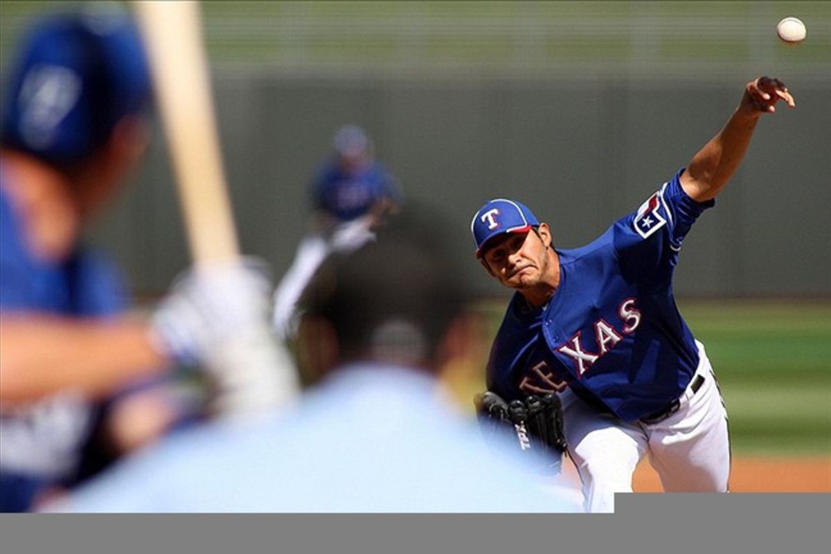 Mar 9, 2012; Surprise, AZ, USA; Texas Rangers starting pitcher Martin Perez (33) pitches during the second inning against the Los Angeles Dodgers at Surprise Stadium.  Mandatory Credit: Jake Roth-US PRESSWIRE