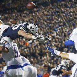 Brigham Young Cougars defensive lineman Corbin Kaufusi (90) tries to block a pit by Boise State Broncos kicker Joel Velazquez (46) in Provo on Friday, Oct. 6, 2017.