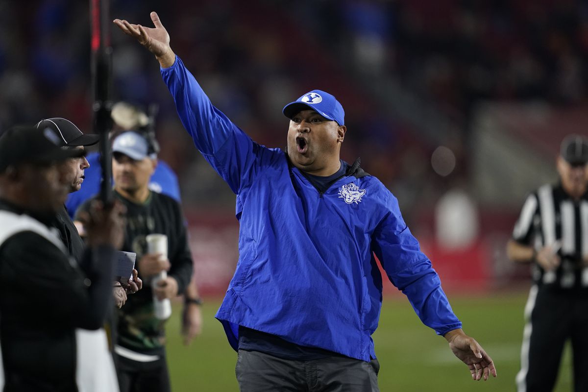 BYU coach Kalani Sitake exhorts the fans during game against Southern California in Los Angeles, Saturday, Nov. 27, 2021. 