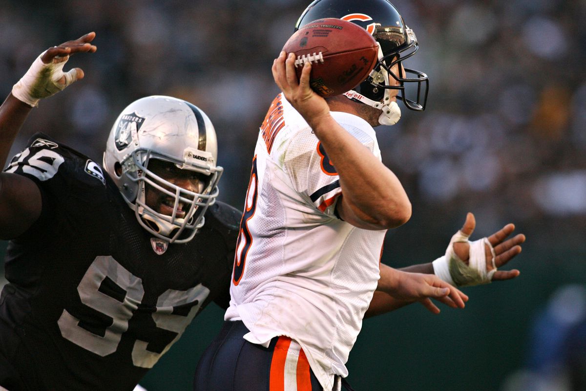Oakland Raiders defensive end Warren Sapp, left, pressures Chicago Bears quarterback Rex Grossman in the fourth quarter of their NFL football game, Sunday, Nov. 11, 2007 at McAfee Coliseum in Oakland, Calif. The Bears won, 17-6. (D. Ross Cameron/The Oak