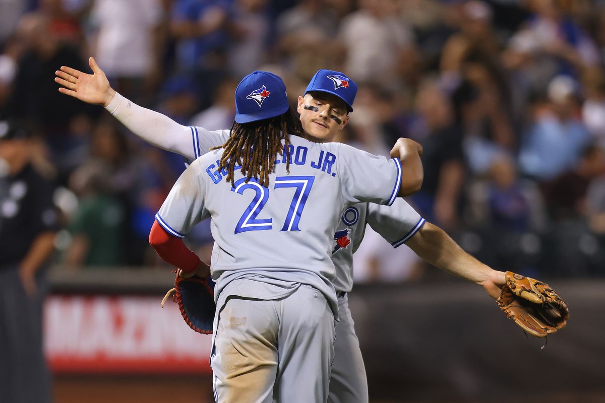 Vladimir Guerrero Jr. and Matt Chapman of the Toronto Blue Jays celebrate after defeating the New York Mets 1-0 at Citi Field on June 02, 2023 in New York City.