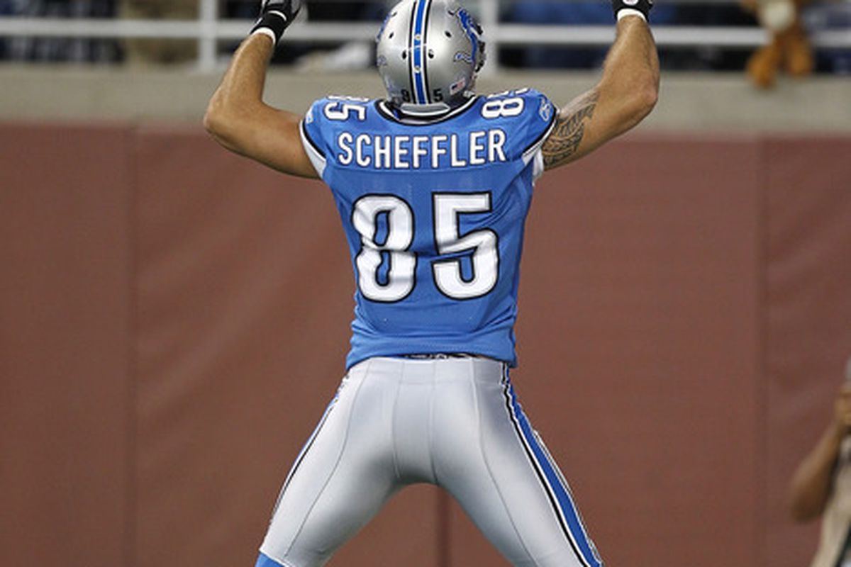 DETROIT, MI - SEPTEMBER 18:  Tony Scheffler #85 of the Detroit Lions pumps his arms after scoring a touchdown against the Kansas City Chiefs at Ford Field on September 18, 2011 in Detroit, Michigan.  (Photo by Dave Reginek/Getty Images)