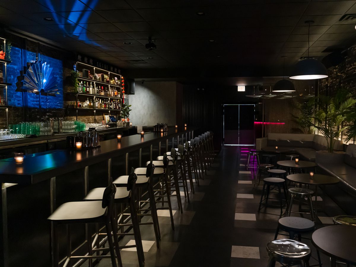 A dark bar with blue lighting.
