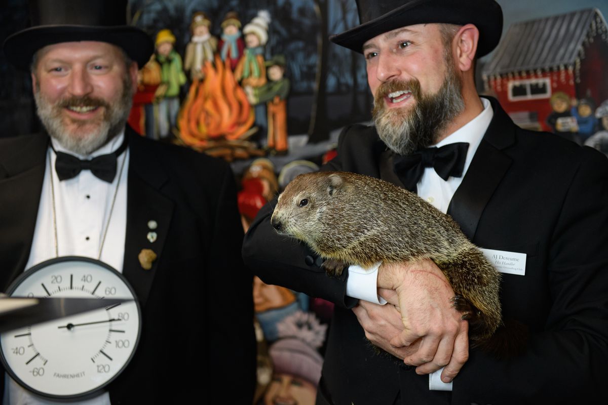 Punxsutawney Groundhog Club Inner Circle Members Jason Gursky and official handler, AJ Dereume and Punxsutawney Phil, the weather-predicting groundhog, work a Zoom call with schoolchildren in hundreds of schools throughout the United States on Gobblers Knob on February 1, 2021 in Punxsutawney, Pennsylvania.