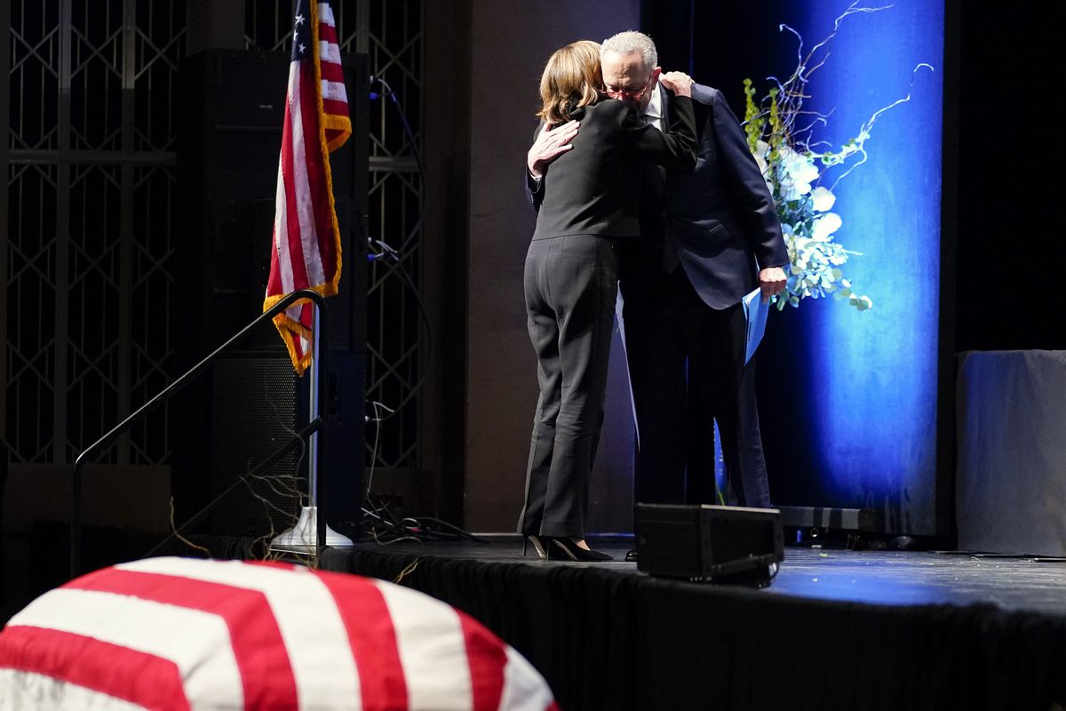 Senate Majority Leader Chuck Schumer, D-N.Y., hugs House Speaker Nancy Pelos   i, D-Calif., at Harry Reid's memorial service.