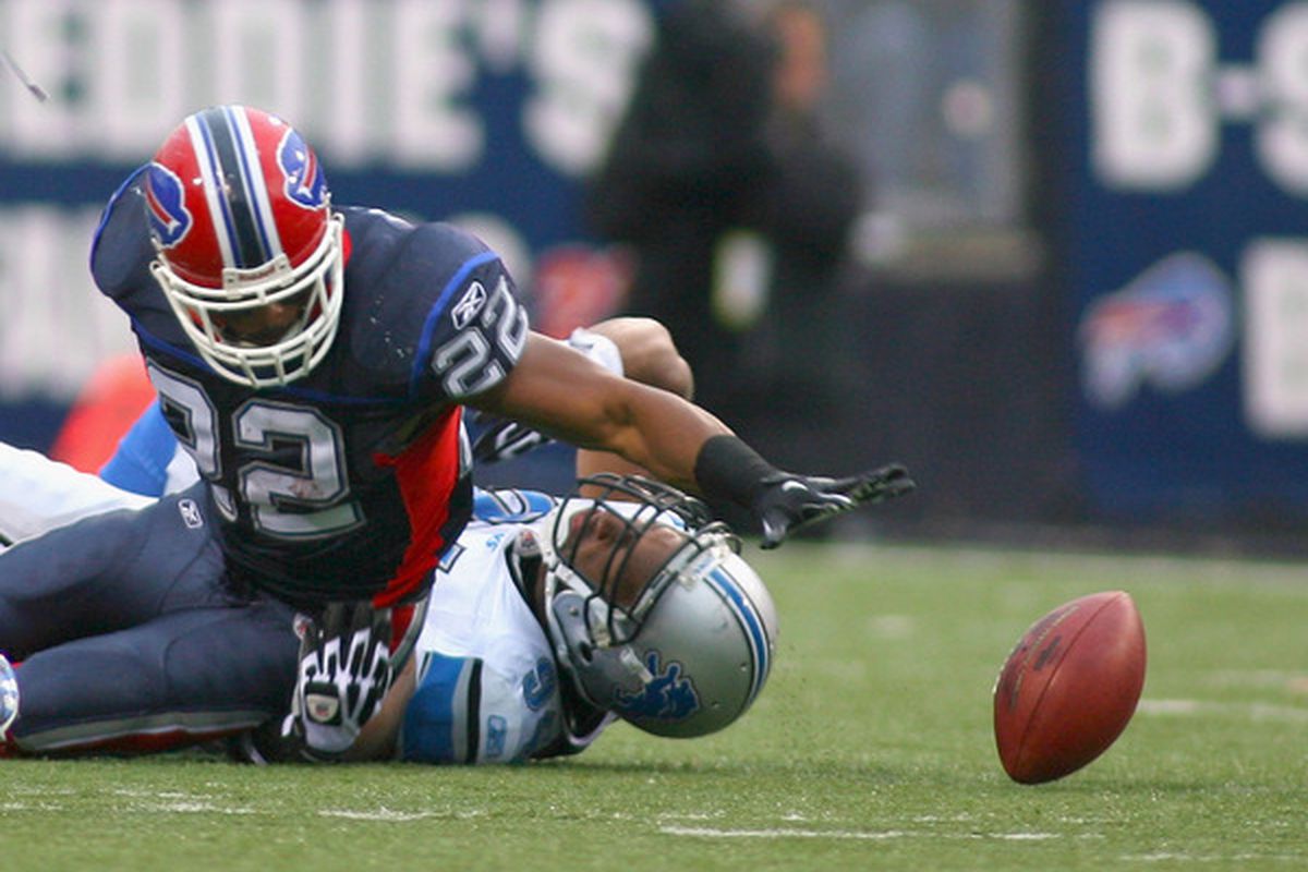 ORCHARD PARK NY - NOVEMBER 14: Fred Jackson #22 of the Buffalo Bills fumbles while being tackled by Lawrence Jackson #94 of the Detroit Lions at Ralph Wilson Stadium on November 14 2010 in Orchard Park New York.  (Photo by Rick Stewart/Getty Images)