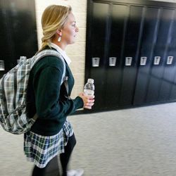 Amanda Higgs, a senior at St. Joseph Catholic High School in Ogden, walks to her locker Wednesday, Oct. 1, 2014, between classes.