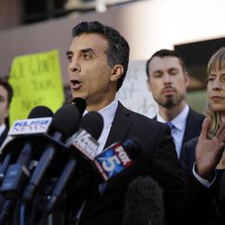 Plaintiff attorney Jason Forge speaks after a hearing for a lawsuit against President-elect Donald Trump and the now-defunct Trump University Friday, Nov. 18, 2016, in San Diego. Trump agreed Friday to pay $25 million to settle several lawsuits alleging that his former business venture for real estate investors defrauded students who paid up to $35,000 to enroll in Trump University programs. 