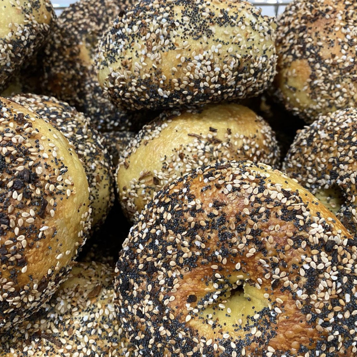 several everything bagels in a pile