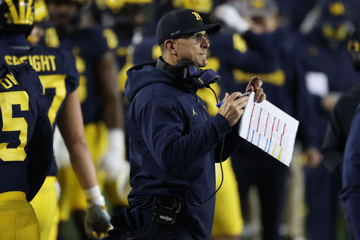 Head coach Jim Harbaugh looks on while playing the Wisconsin Badgers at Michigan Stadium on November 14, 2020 in Ann Arbor, Michigan.