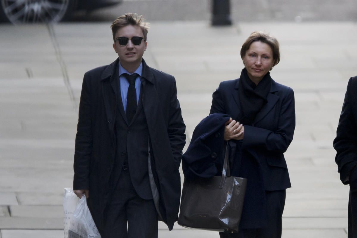 Marina Litvinenko, the widow of former Russian intelligence officer Alexander Litvinenko, arrives with her son Anatoly on the day she is due to give evidence at the inquiry into her husband's death at the Royal Courts of Justice in London, Monday, Feb. 2,