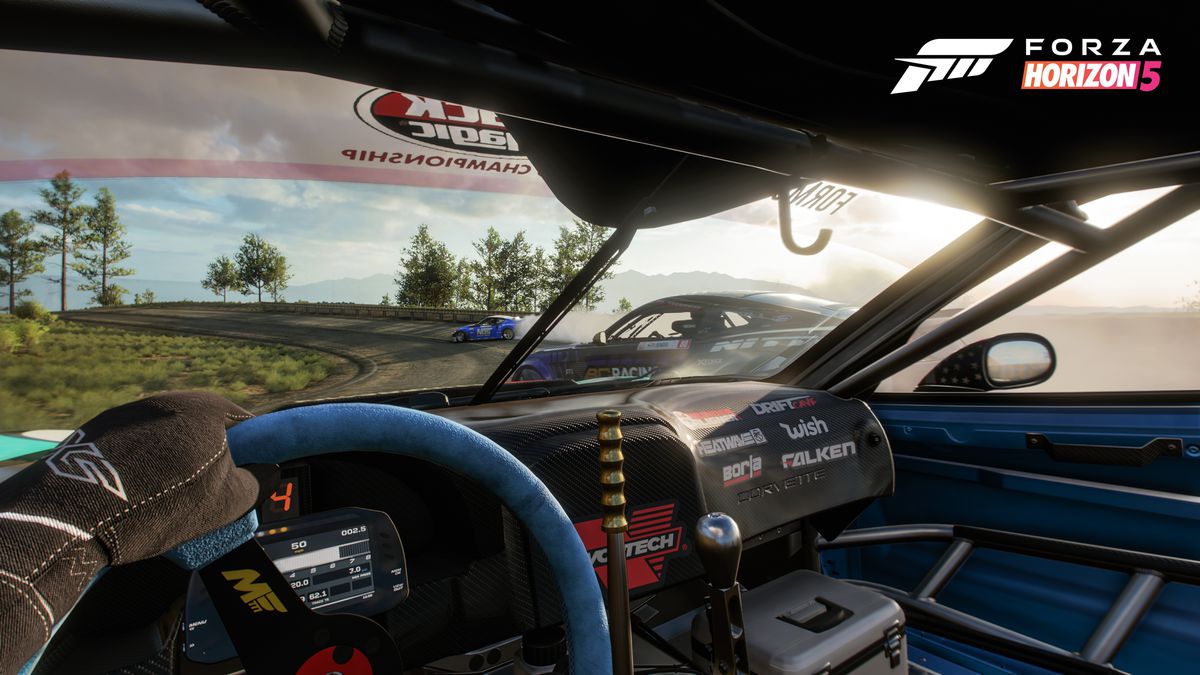 interior view of a racing-tuned sports car in Forza Horizon 5; it’s being cut off by a competitor surging in on the right.