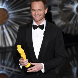 Host Neil Patrick Harris holds a Lego Oscar statuette at the Oscars on Sunday, Feb. 22, 2015, at the Dolby Theatre in Los Angeles. 
