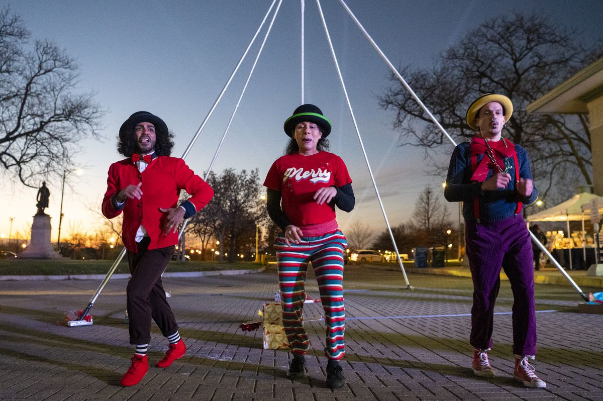 Jean Claudio (from left), Johana Vargas and Xavier Claudio, circus performers with La Vuelta, dance during Destinos al Aire, A Holiday Extravaganza, at the Humboldt Park Boathouse on Friday, Dec. 3, 2021.