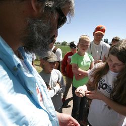 Hanna Boyd, right, holds a garter snake Wednesday, June 5, 2013, during the first day of the Utah State University Uintah Basin Biology Field Camp. The two-day camp, held at the USU campus in Vernal, is part of the university's effort to promote science, technology, engineering and math education for secondary students.