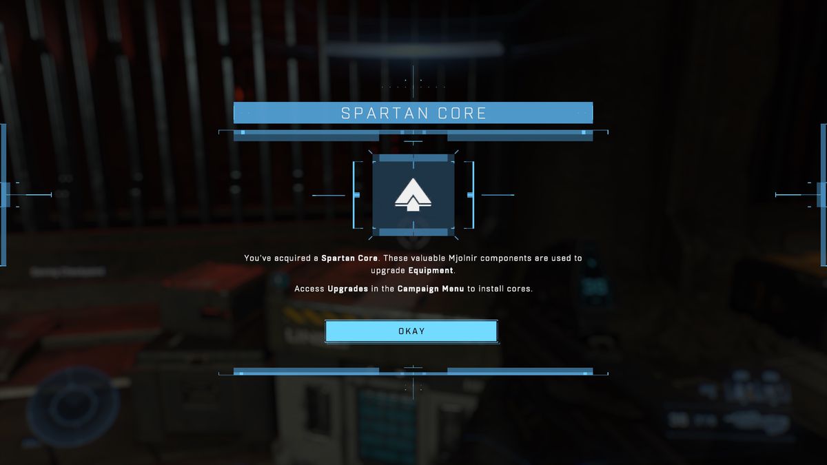 A Halo Infinite screenshot describing a Spartan Core, which reads “You’ve acquired a Spartan Core. These valuable Miolnir components are used to upgrade Equipment. Access Upgrades in the Campaign Menu to install cores.”