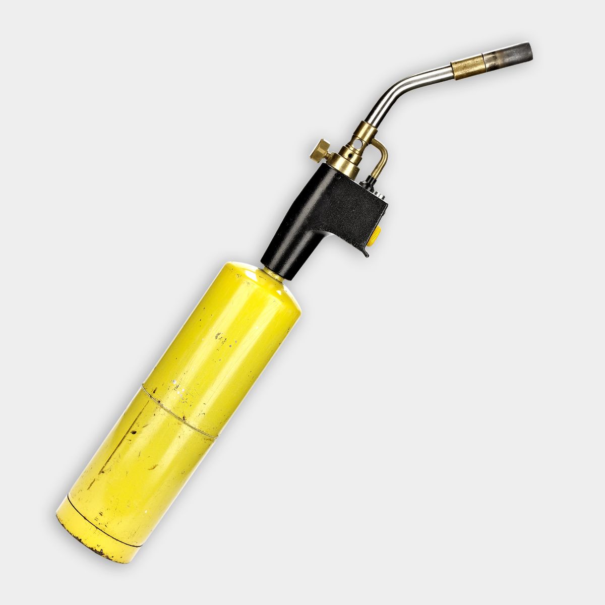 propane torch on grey background