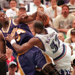 Shaquille O'Neil fouls Karl Malone during the last game of a Lakers series on May 13, 1997.