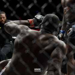 Israel Adesanya knocks Derek Brunson down  at UFC 230.