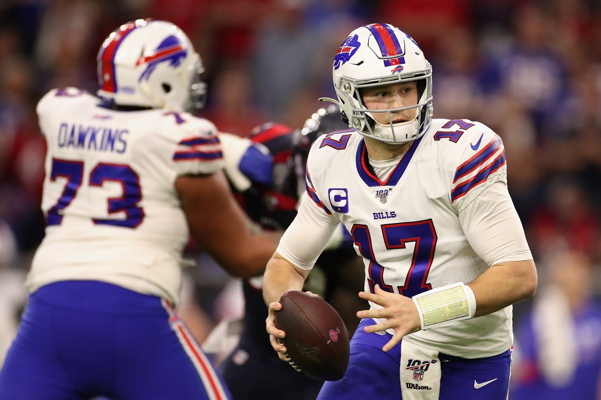 Quarterback Josh Allen #17 of the Buffalo Bills scrambles with the football during the NFL Wild Card playoff game against the Houston Texans at NRG Stadium on January 04, 2020 in Houston, Texas.