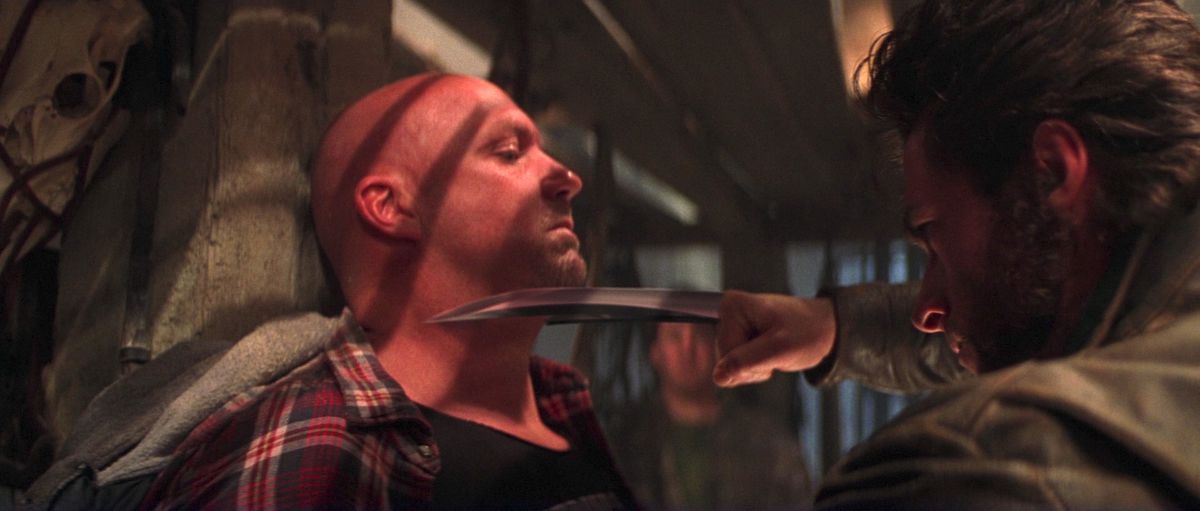 Wolverine holds his claws against a stave cracker in X-Men.  from 2000