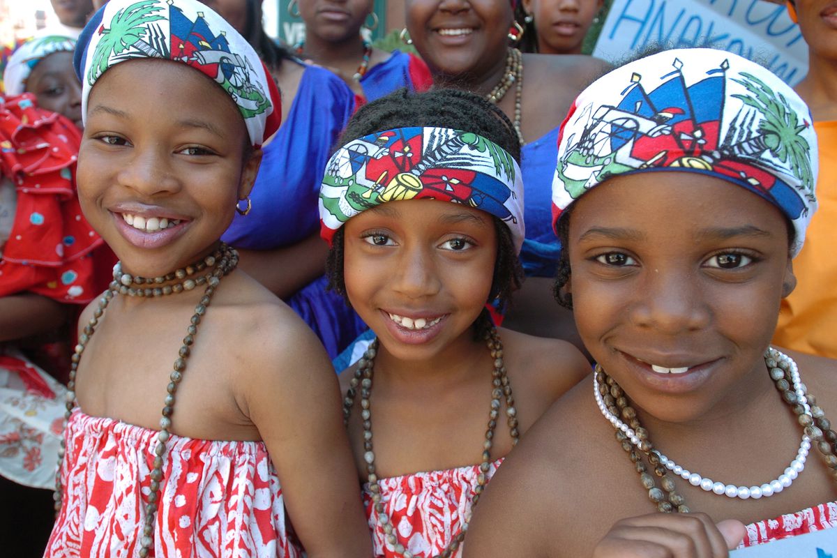 Three little girls at the Haitian-American Independence Day Parade, in Brooklyn