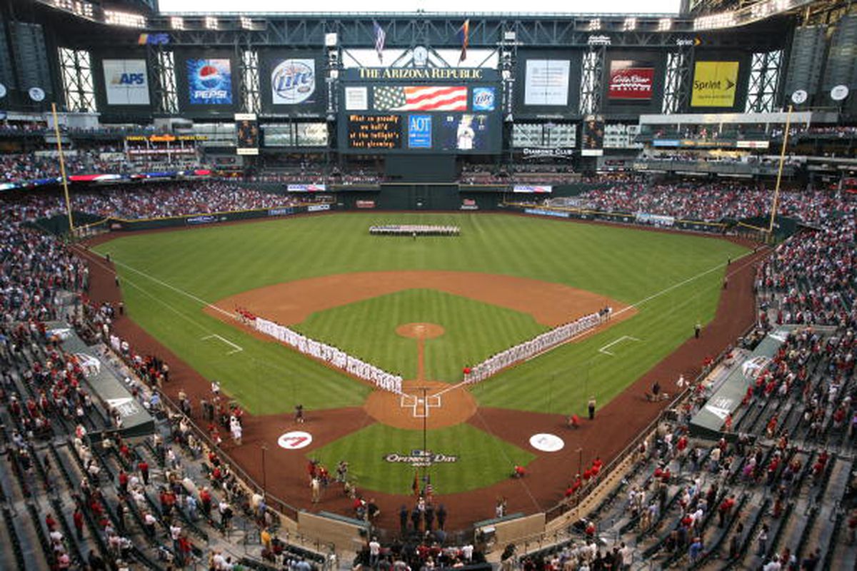 The Reds and Diamondbacks line up for the National Anthem before the opening-day game on April 9, 2007 at Chase Field.