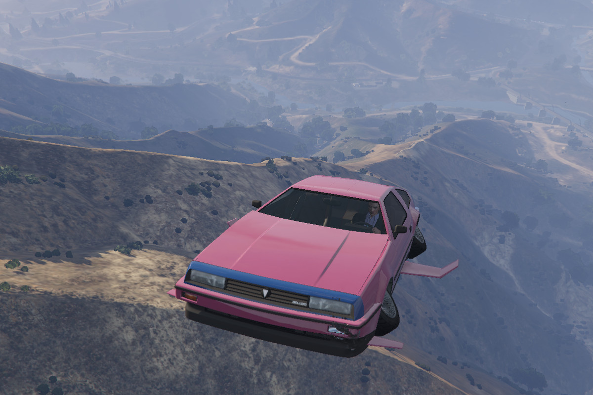 Grand Theft Auto Online - a pink Deluxo takes to the skies over mountains