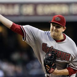 Arizona Diamondbacks starting pitcher Trevor Cahill releases  pitch against the San Diego Padres during the first inning of a baseball game in San Diego, Friday, June 14, 2013. 
