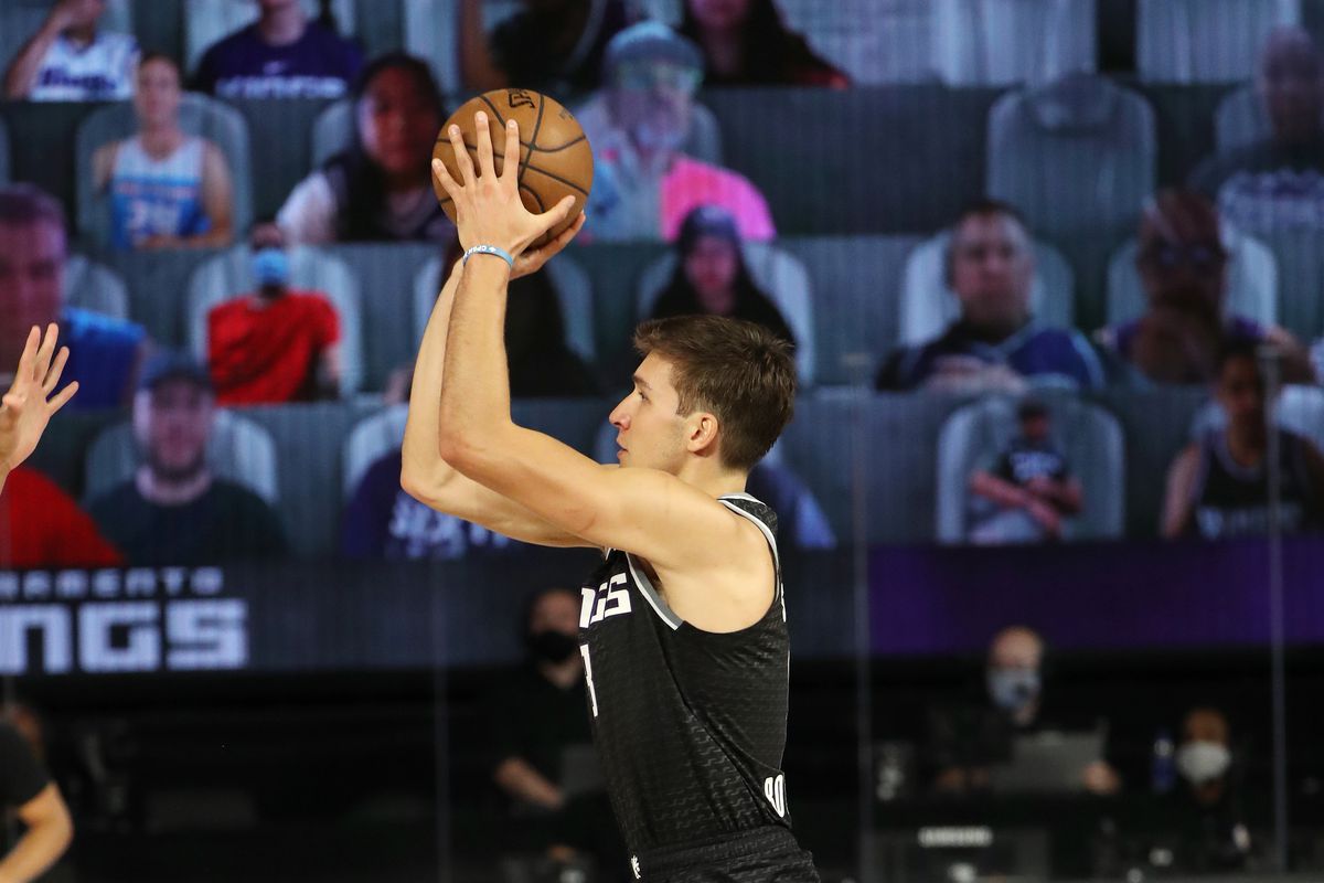Bogdan Bogdanovic of the Sacramento Kings shoots a three point basket during the game against the New Orleans Pelicans on August 6, 2020 at The HP Field House at ESPN Wide World Of Sports Complex in Orlando, Florida.