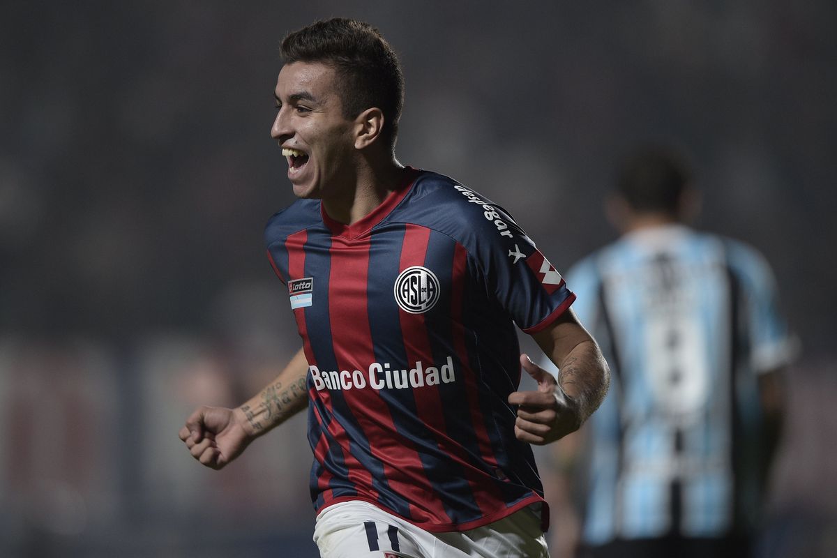 Argentina's San Lorenzo midfielder Angel Correa celebrates after scoring against Brazil's Gremio during the Copa Libertadores 2014 round before the quarterfinals first leg football match at Pedro Bidegain stadium in Buenos Aires, Argentina, on April 