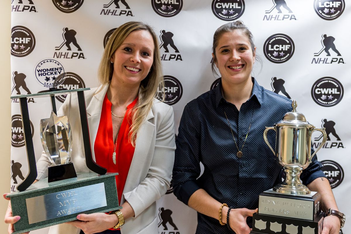 Kelli Stack of the Kunlun Red Star holds the CWHL MVP trophy and Jamie Lee Rattray of the Markham Thunder holds the Jayna Hefford trophy