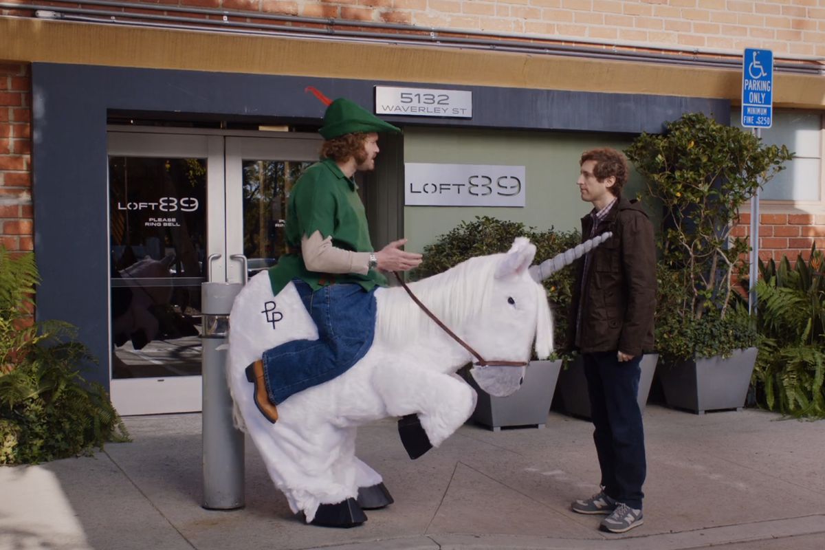 Erlich from the show “Silicon Valley” rides a unicorn 