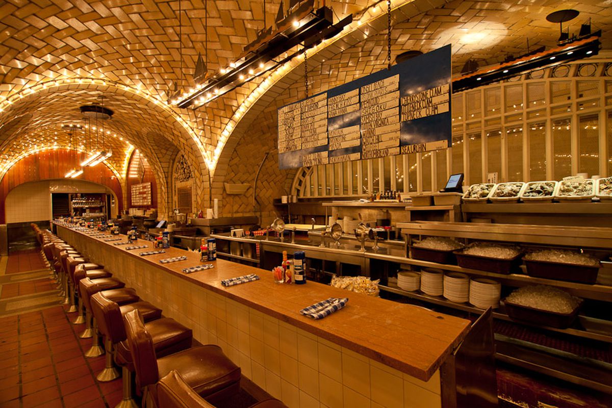 A well-lit bar in a tunnel with curving arches 