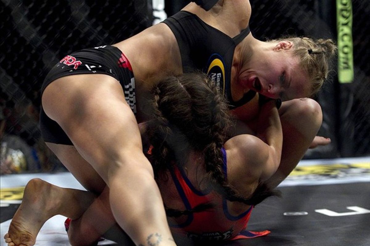 March 3, 2012; Columbus, OH, USA; Ronda Rousey punches Miesha Tate during the Strikeforce Grand Prix final at Nationwide Arena. Mandatory Credit: Greg Bartram-US PRESSWIRE