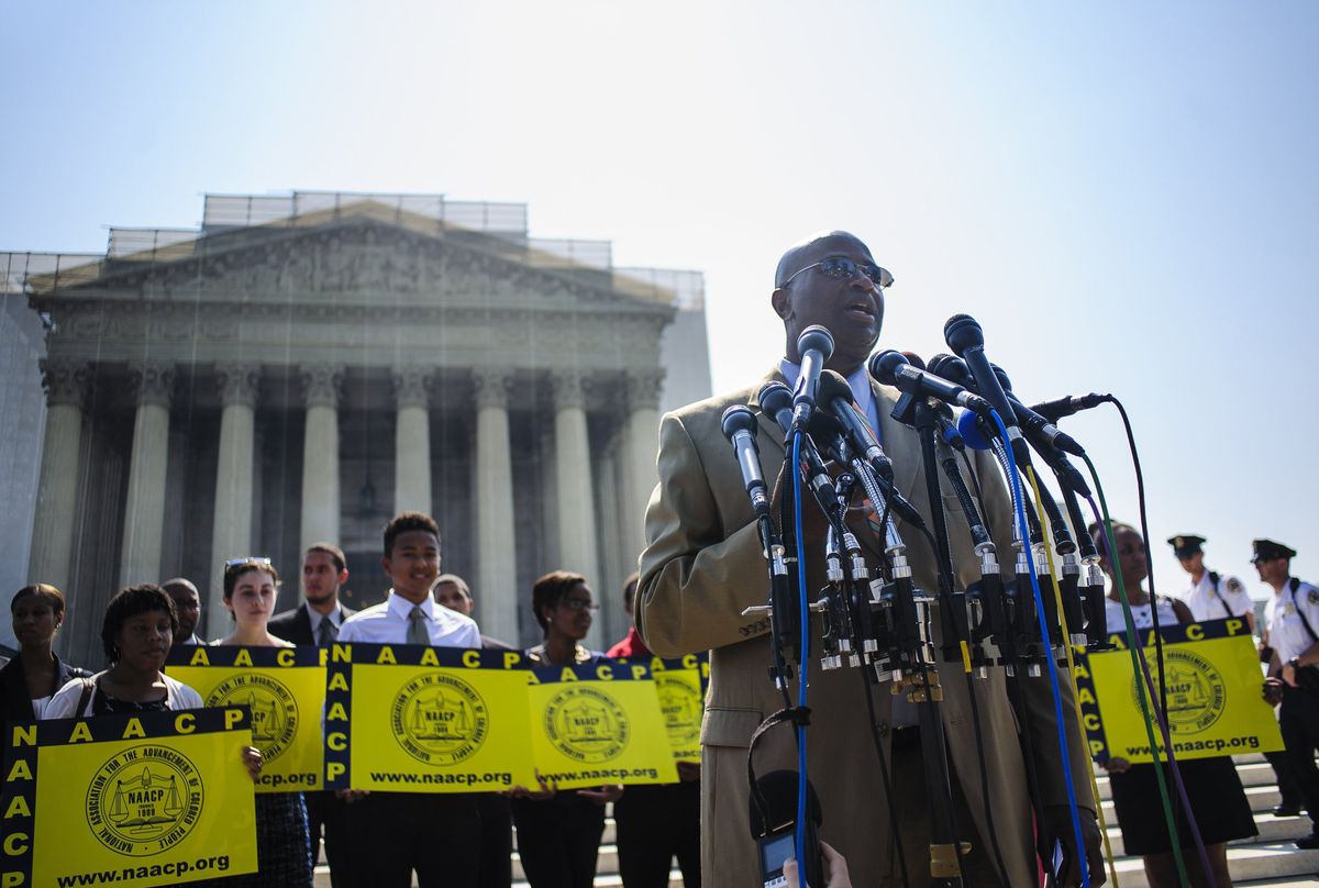 Members of the NAACP speak shortly after the Supreme Court invalidated a key portion of the Voting Rights Act of 1965 on June 25, 2013. 