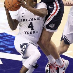 Brigham Young Cougars guard Brandon Averette (4) shoots under Gonzaga Bulldogs forward Corey Kispert (24) during a basketball game at the Marriott Center in Provo on Monday, Feb. 8, 2021. BYU lost 71-82.