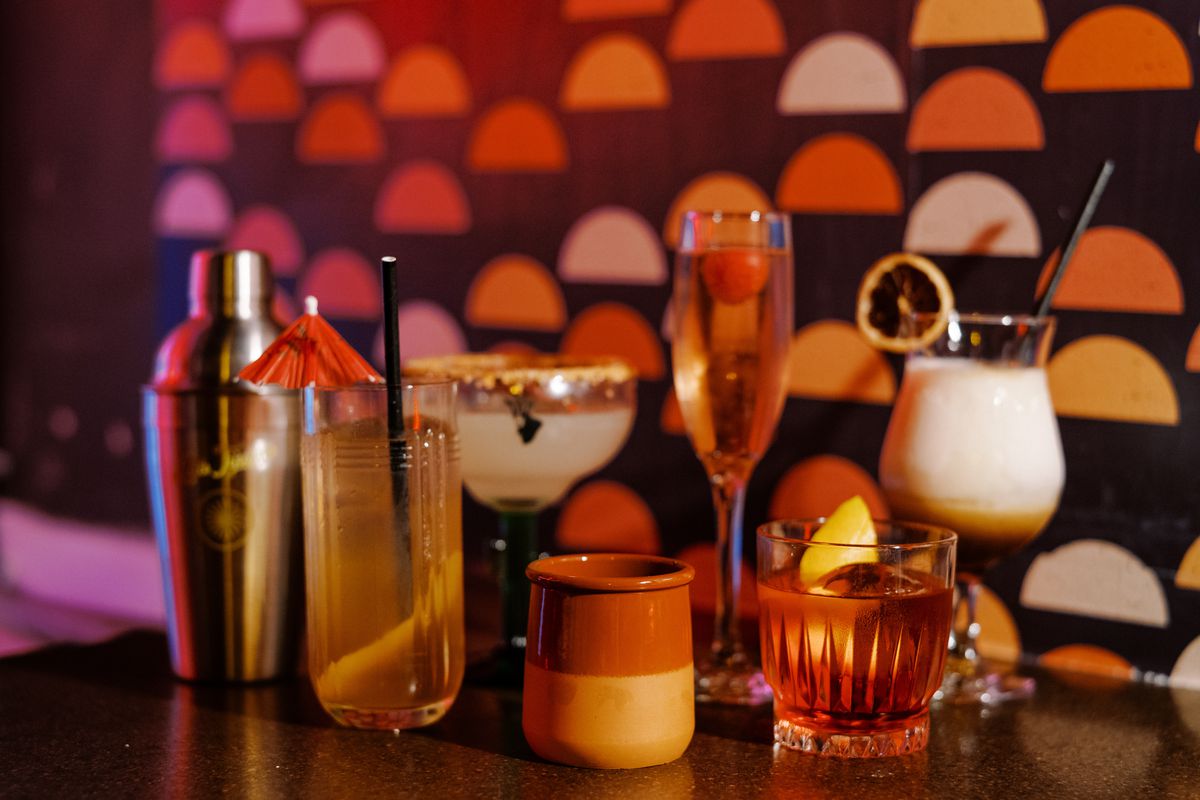An assortment of cocktails on a table.