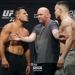 Rafael dos Anjos and Colby Covington pose at UFC 225 weigh-ins.